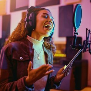 A girl is singing in a studio for song production and rehearsal